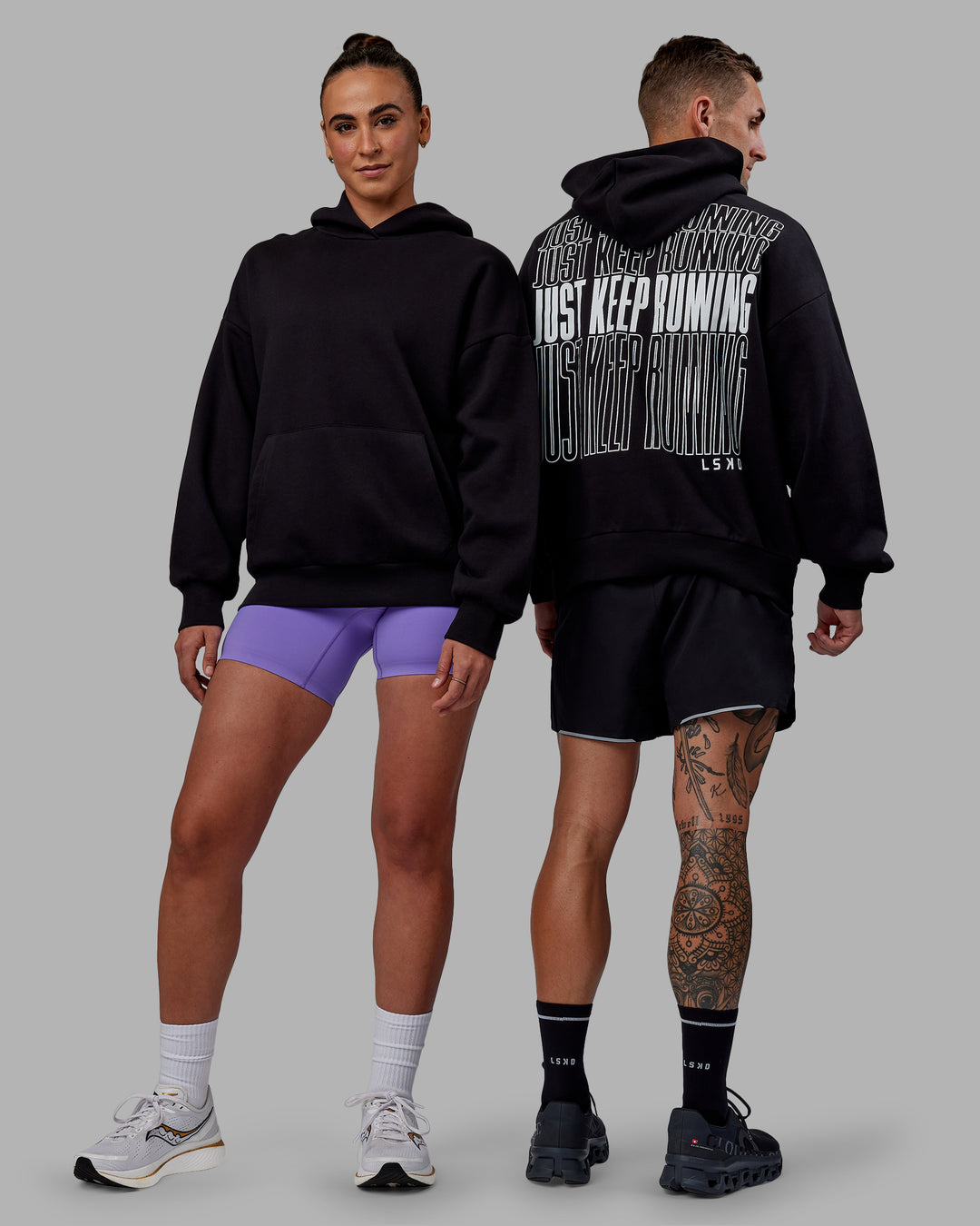 Duo wearing Unisex Keep on Running Hoodie Oversize - Black-White