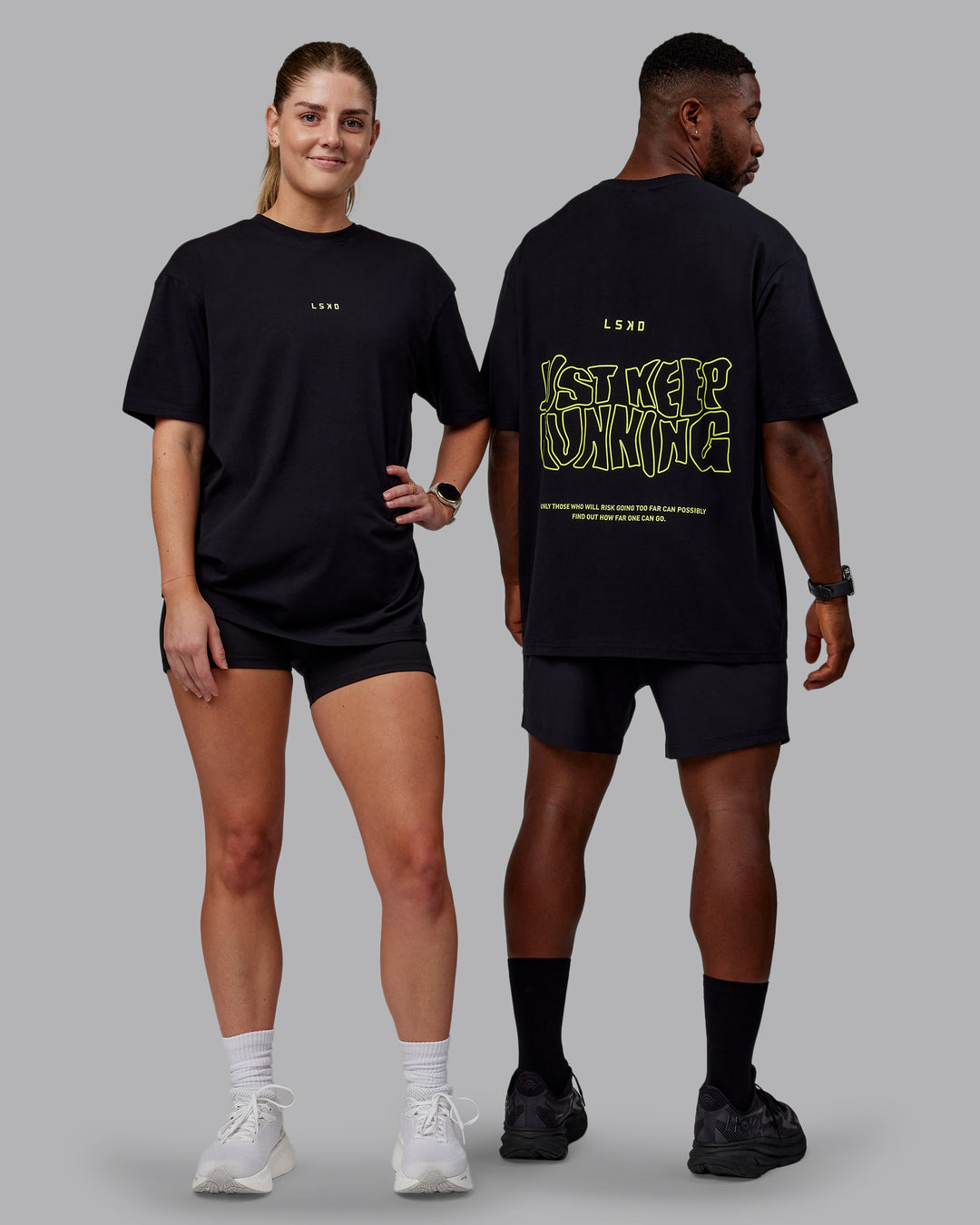 Duo wearing Unisex Leg It FLXCotton Tee Oversize - Black-Volt