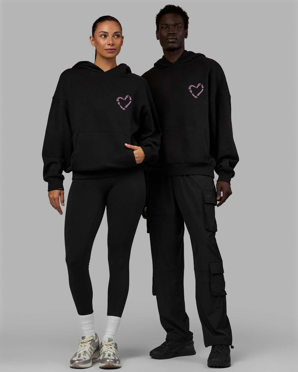 Duo wearing Unisex Love The Process Oversize Hoodie - Black-Bubble Gum