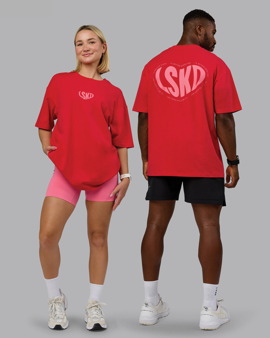 Duo wearing Unisex Love To Train FLXCotton Tee Oversize in Scarlet-Pink Lemonade | Size:Duo