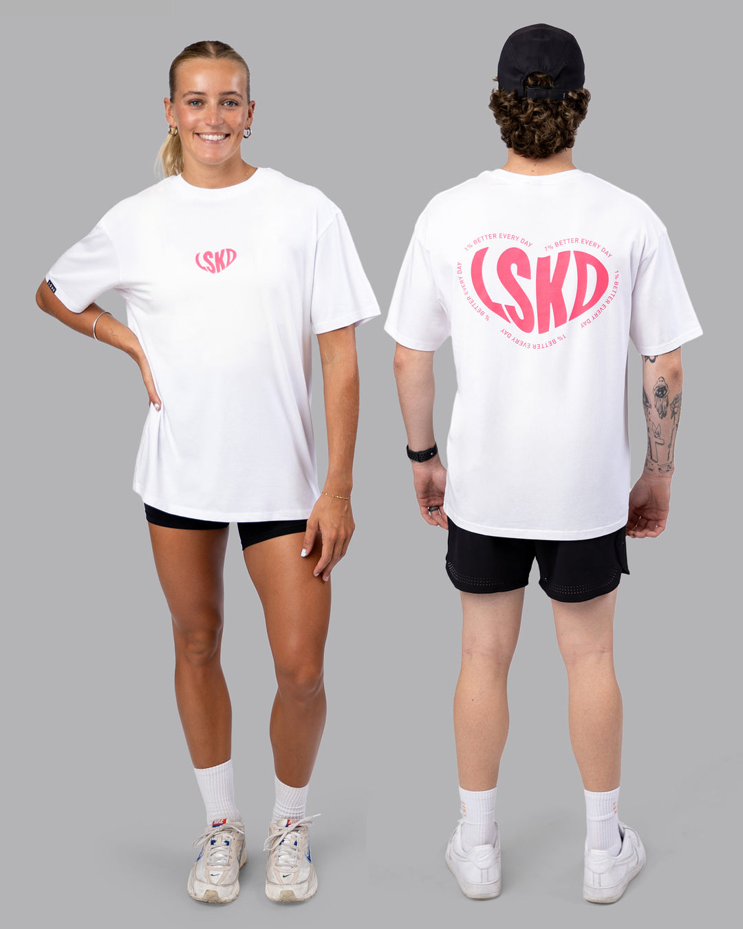 Duo wearing Unisex Love To Train FLXCotton Tee Oversize - White-Pink Lemonade | Size:Duo