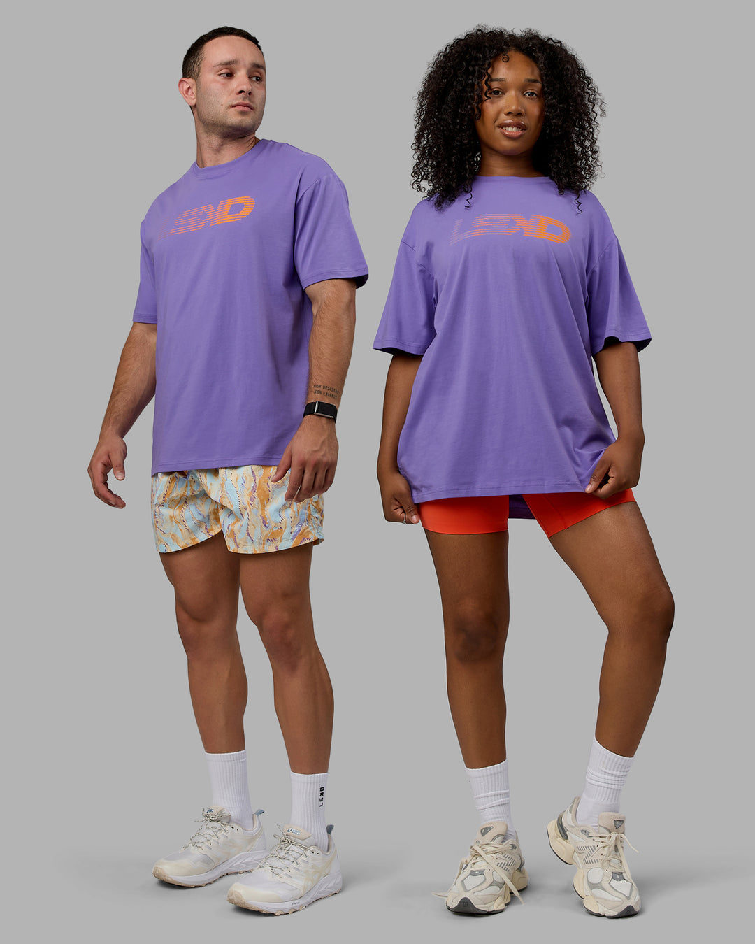 Duo wearing Unisex Motion FLXCotton Tee Oversize - Dahlia Purple-Vibrant Orange