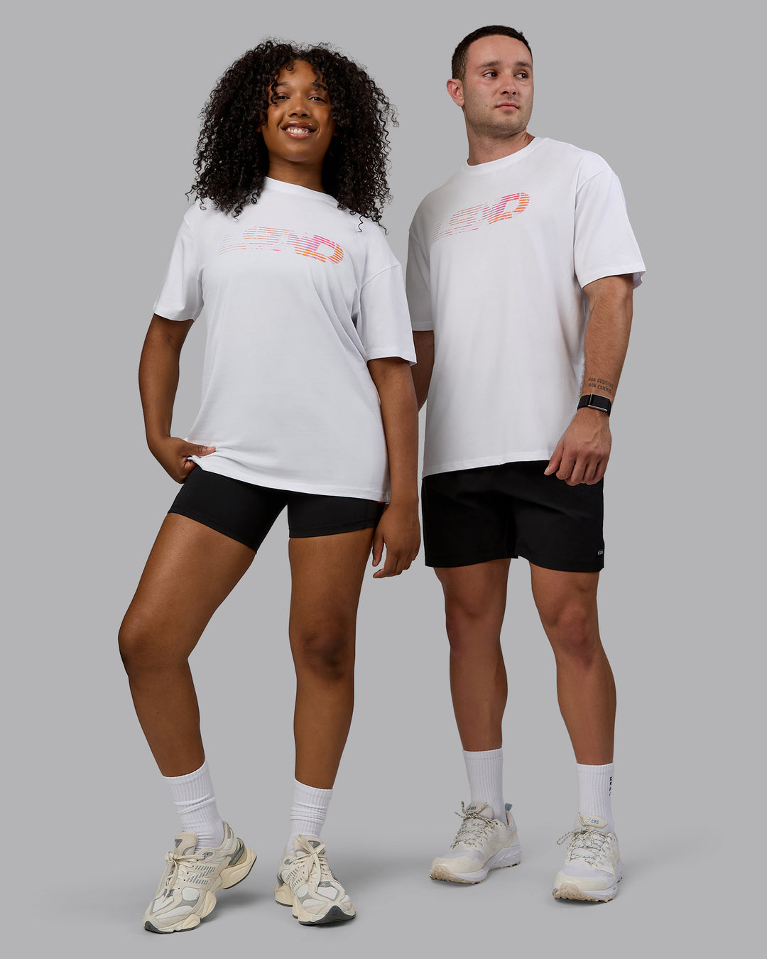 Duo wearing Unisex Motion FLXCotton Tee Oversize - White-React Print