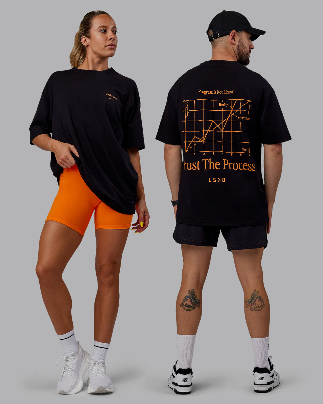 Duo wearing Unisex Trust The Process 2.0 FLXCotton Tee Oversize - Black-Vibrant Orange