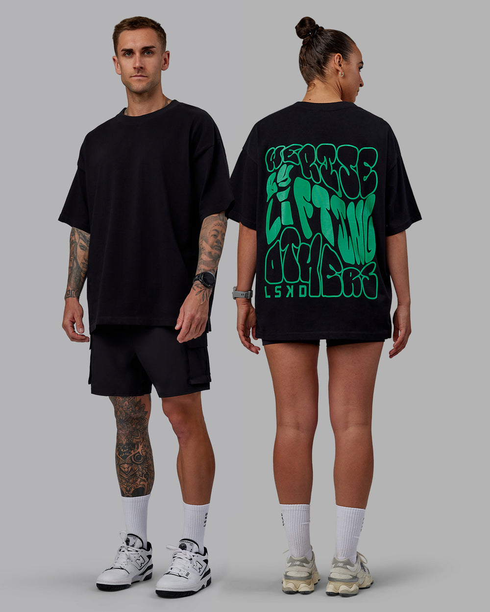 Duo wearing Unisex We Rise Heavyweight Tee Oversize - Black-Impact Green