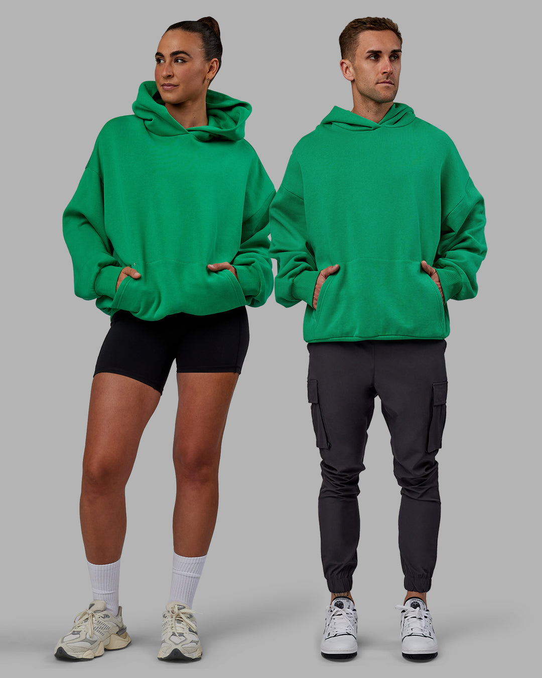 Duo wearing Unisex We Rise Hoodie Oversize - Impact Green-White