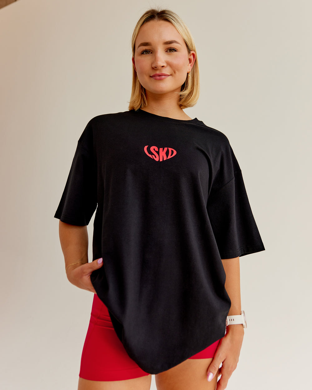 Woman wearing Unisex Love To Train FLXCotton Tee Oversize in Black-Scarlet | Size:L