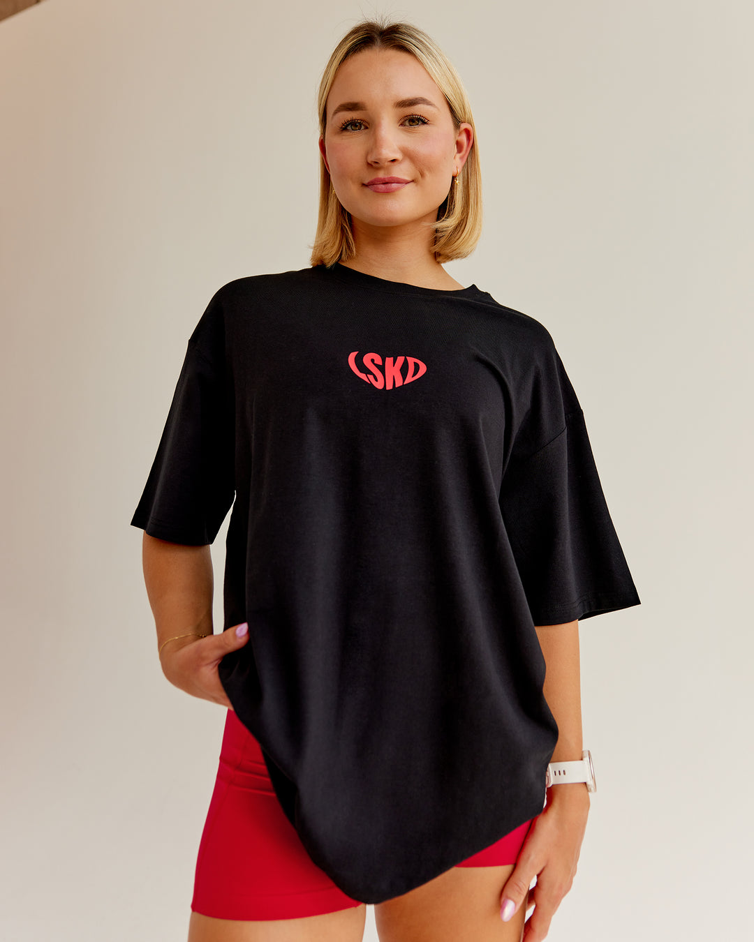 Woman wearing Unisex Love To Train FLXCotton Tee Oversize in Black-Scarlet | Size:L