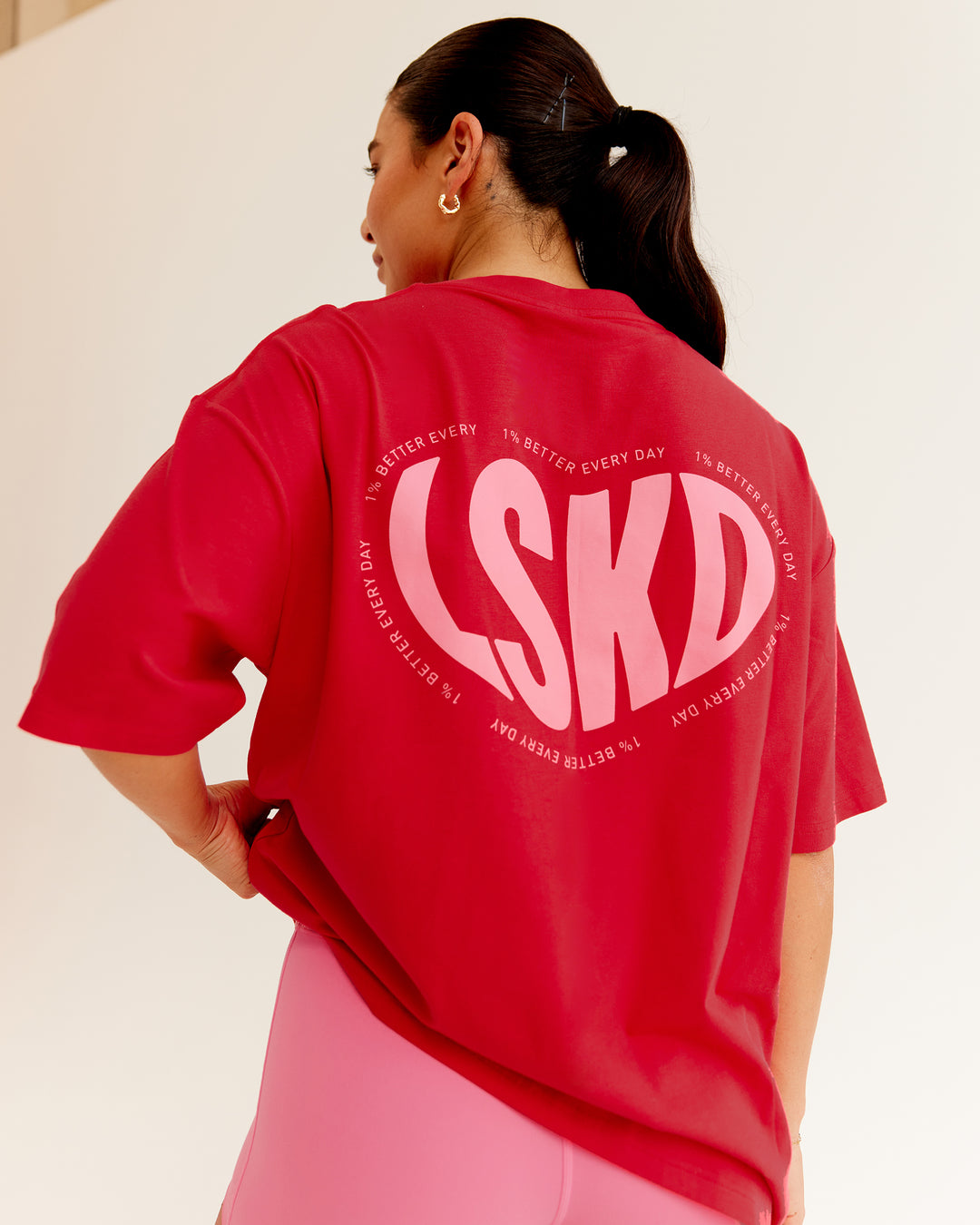 Woman wearing Unisex Love To Train FLXCotton Tee Oversize in Scarlet-Pink Lemonade | Size:L