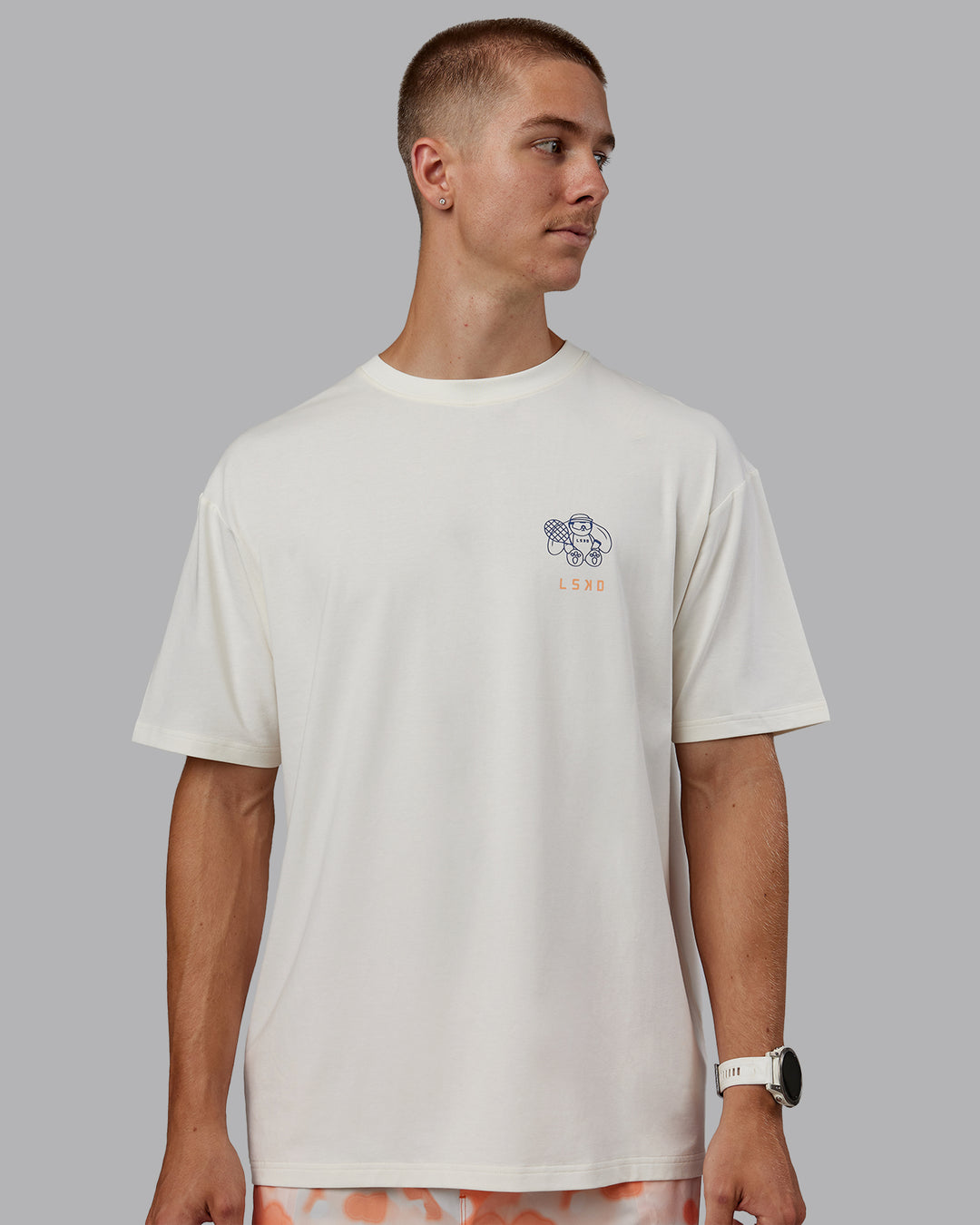 Man wearing Appreciate the Small Things FLXCotton Oversized Tee in Off White-Cantaloupe | Size:L