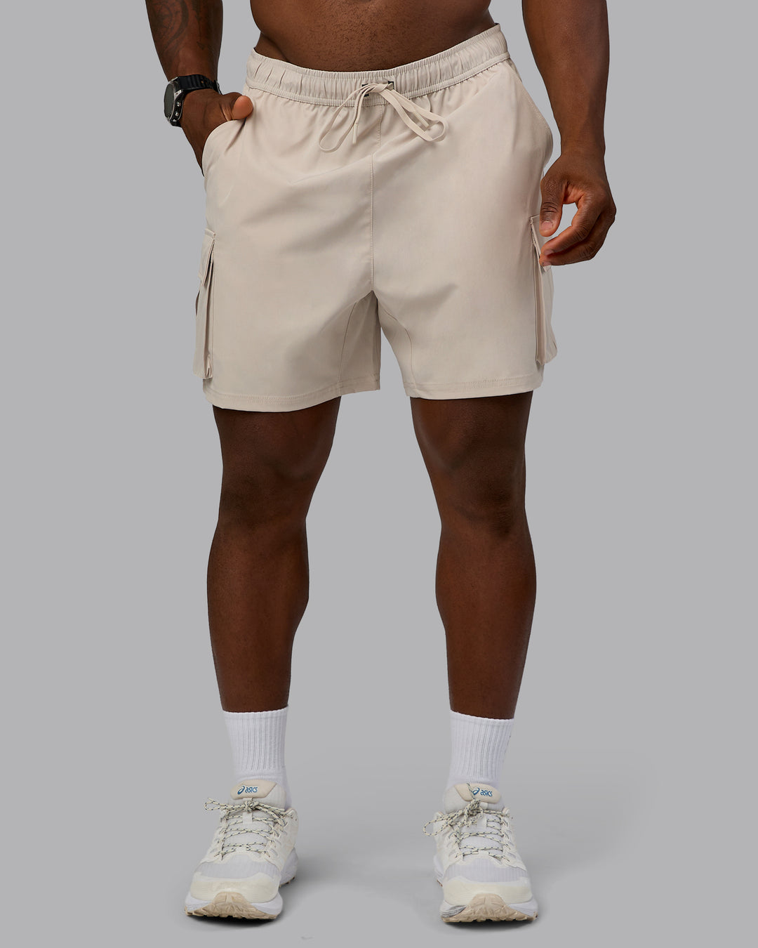 Man wearing Energy Stretch Performance Cargo Short in Shale Beige | Size:L | Model:Sam