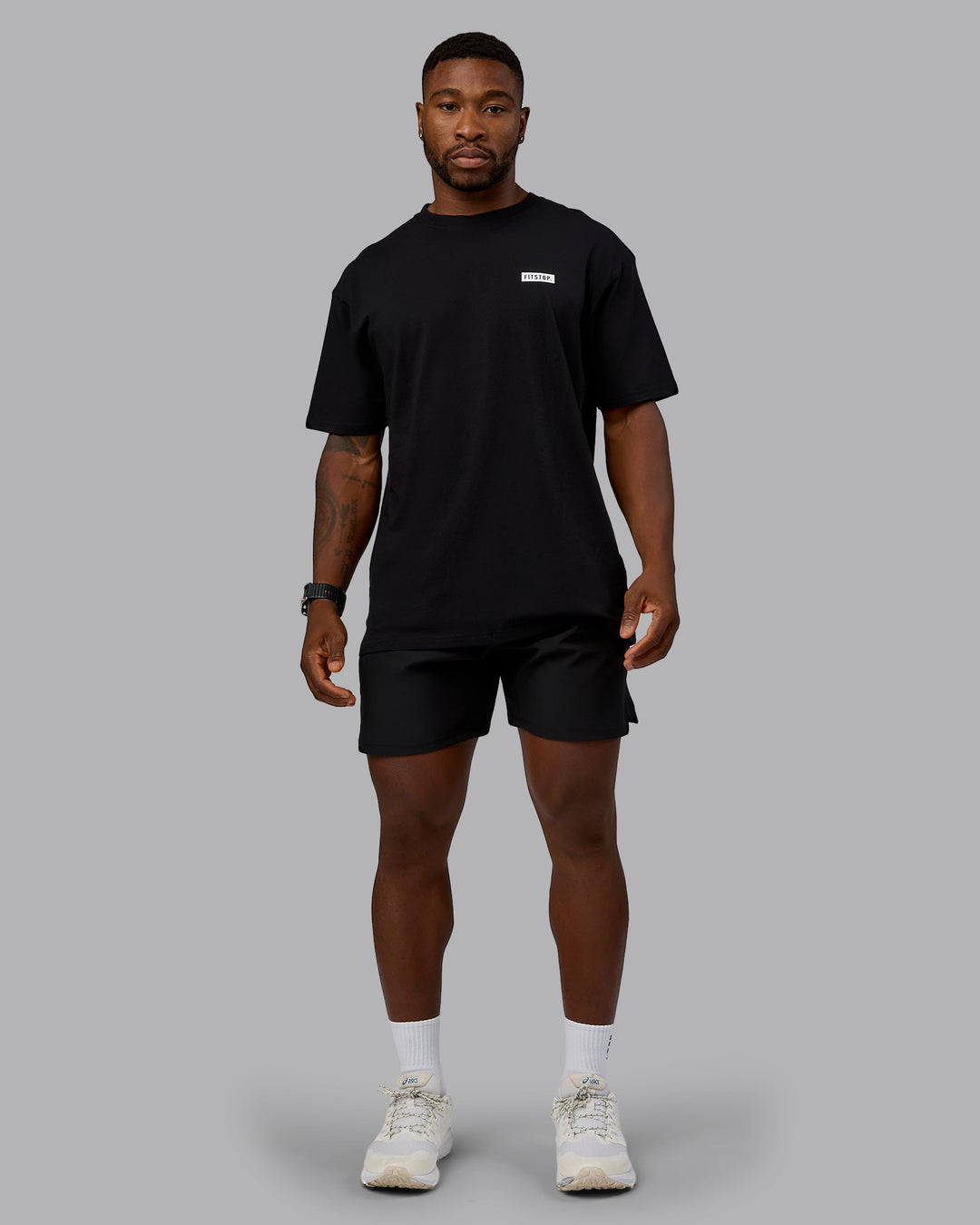 Man wearing Fitstop Embrace the Sweat FLXCotton Oversized Tee in Black-White | Size:L