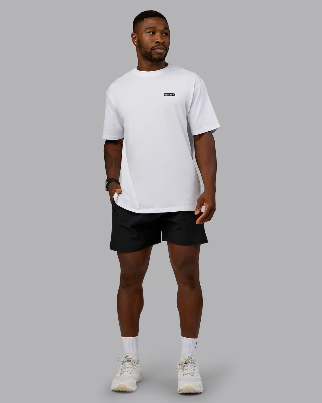 Man wearing Fitstop Embrace the Sweat FLXCotton Oversized Tee in White-Black | Size:L