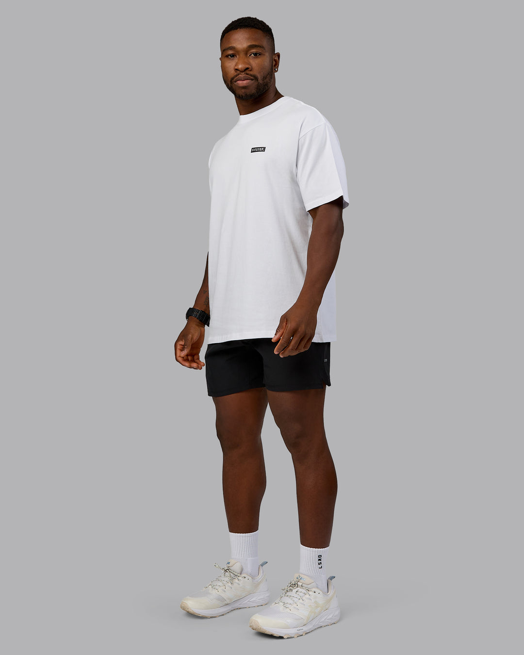 Man wearing Fitstop Embrace the Sweat FLXCotton Oversized Tee in White-Black | Size:L