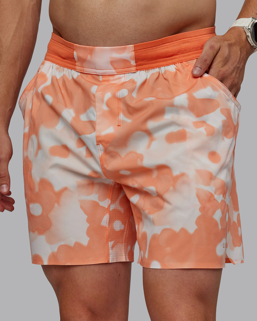 Man wearing Grand Slam 6&quot; Shorts in Wildflower Cantaloupe | Size:L