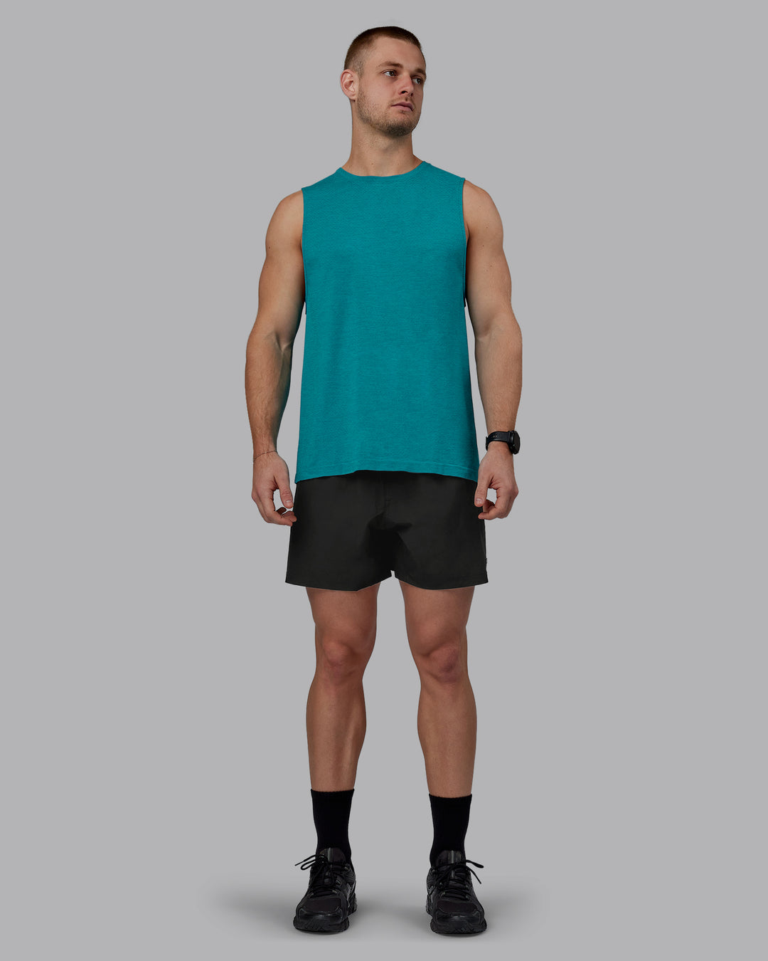 Man wearing AeroFLX+ Seamless Muscle Tank - Blue Bird Marl