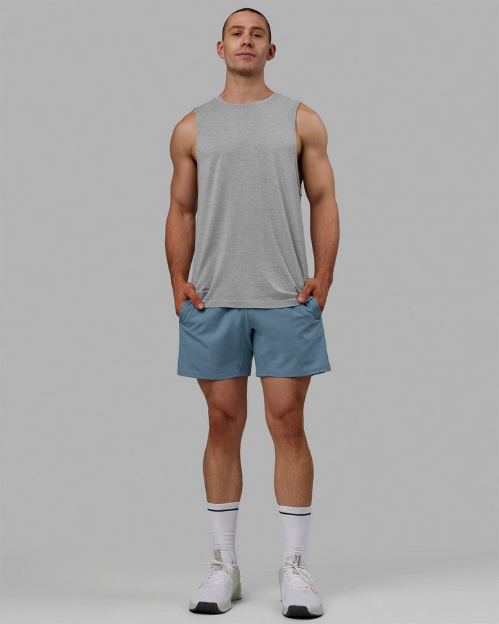 Man wearing AeroFLX+ Seamless Muscle Tank - Lt Grey Marl
