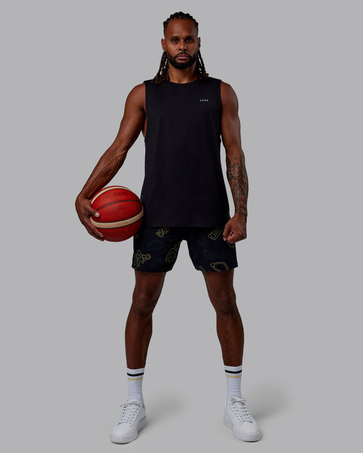 Man wearing Patty Mills Challenger 6&quot; Performance Shorts - Black-Vital Green
