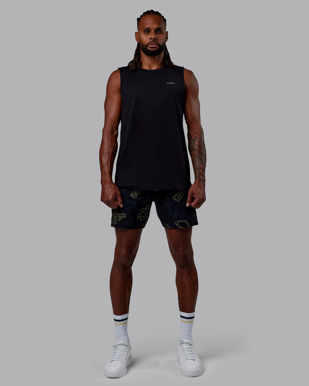 Woman wearing Patty Mills Perform VapourFLX Muscle Tank - Black Reflective