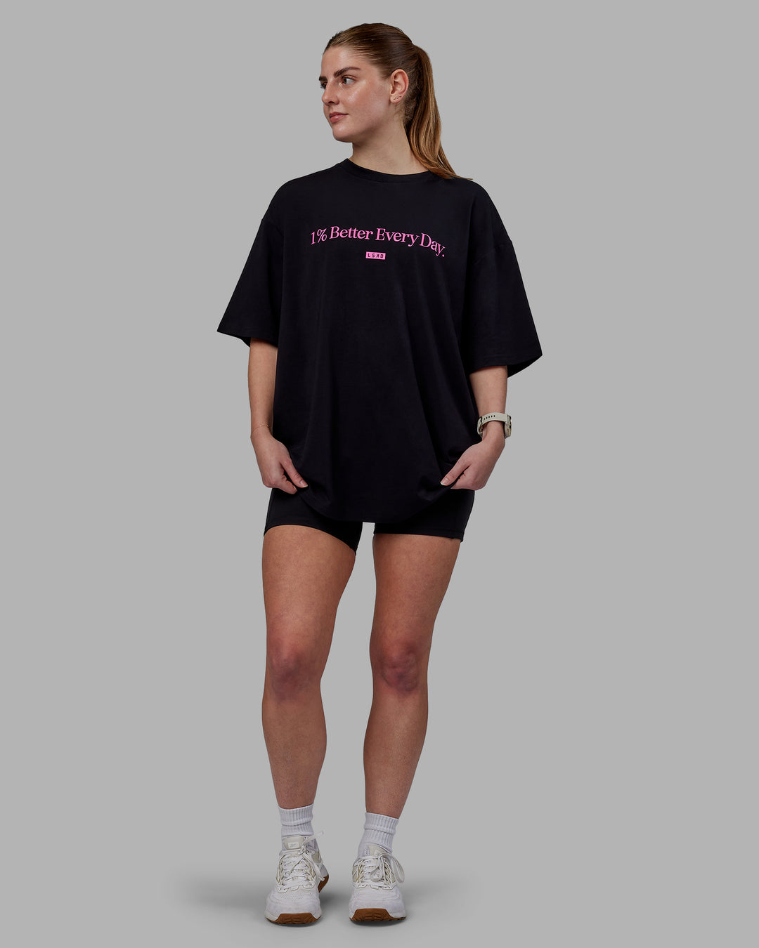 Woman wearing Unisex 1% Better FLXCotton Tee Oversize - Black-Fuschia Pink