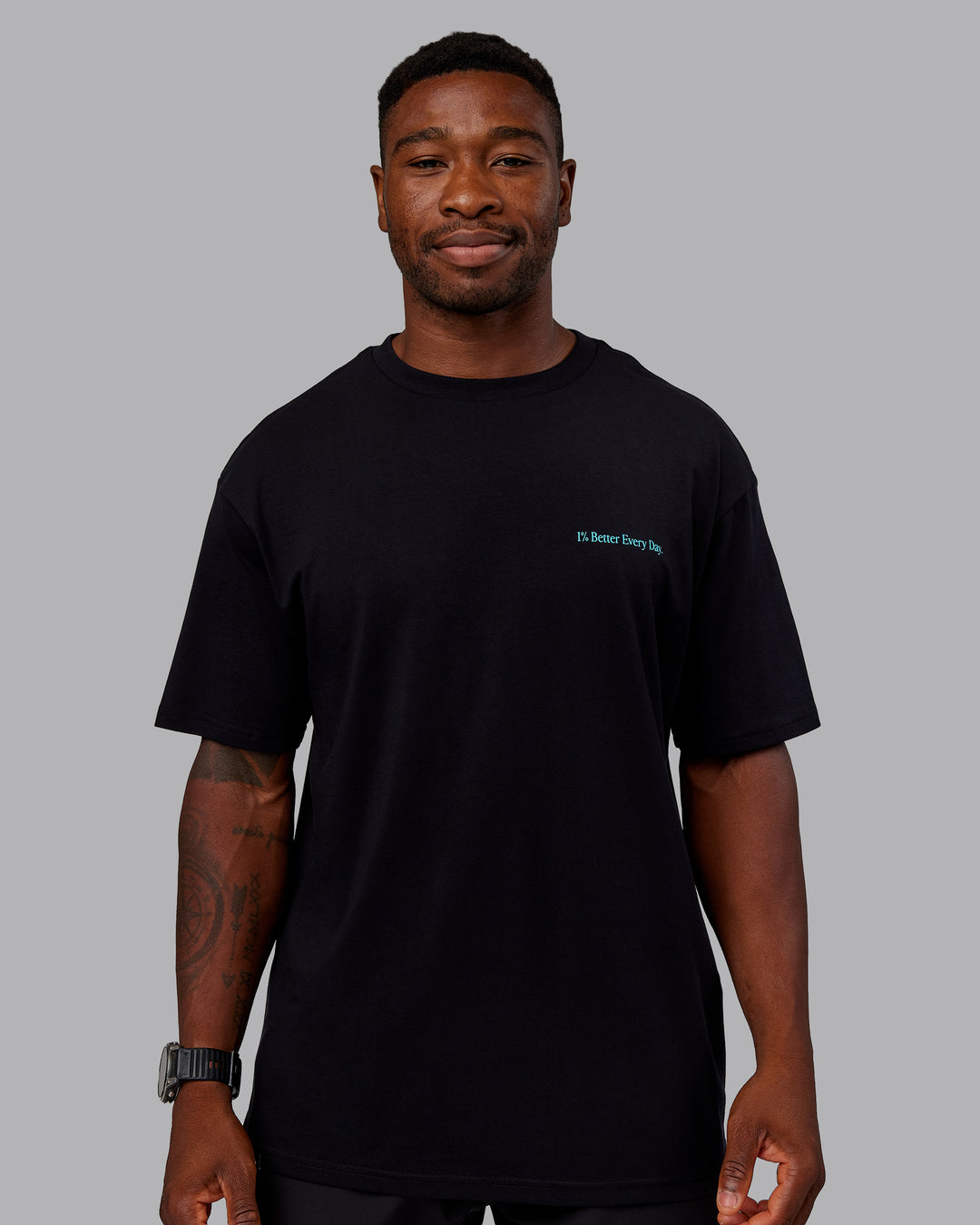 Man wearing Better Every Day FLXCotton Tee Oversize in Black-Blue Atoll | Size:L | Model:Sam