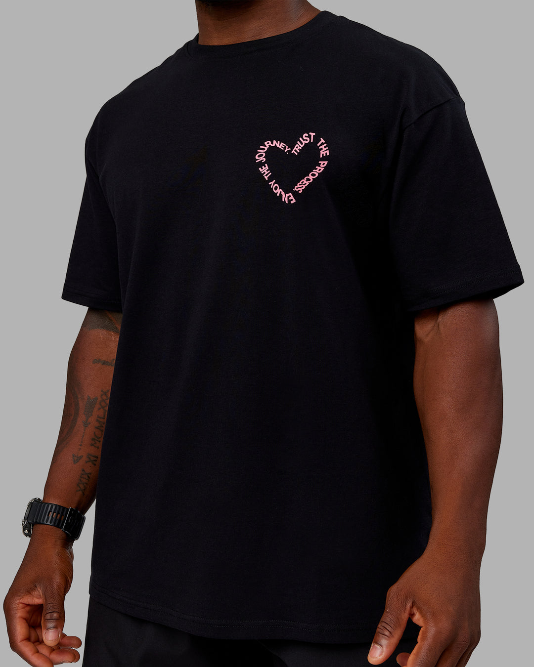 Man wearing Love The Process FLXCotton Oversize Tee - Black-Pink Lemonade | Model:Sam | Size:L