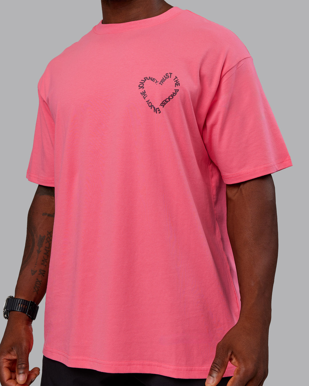 Man wearing Love The Process FLXCotton Oversize Tee - Pink Lemonade-Cherry Lacquer | Model:Sam | Size:L