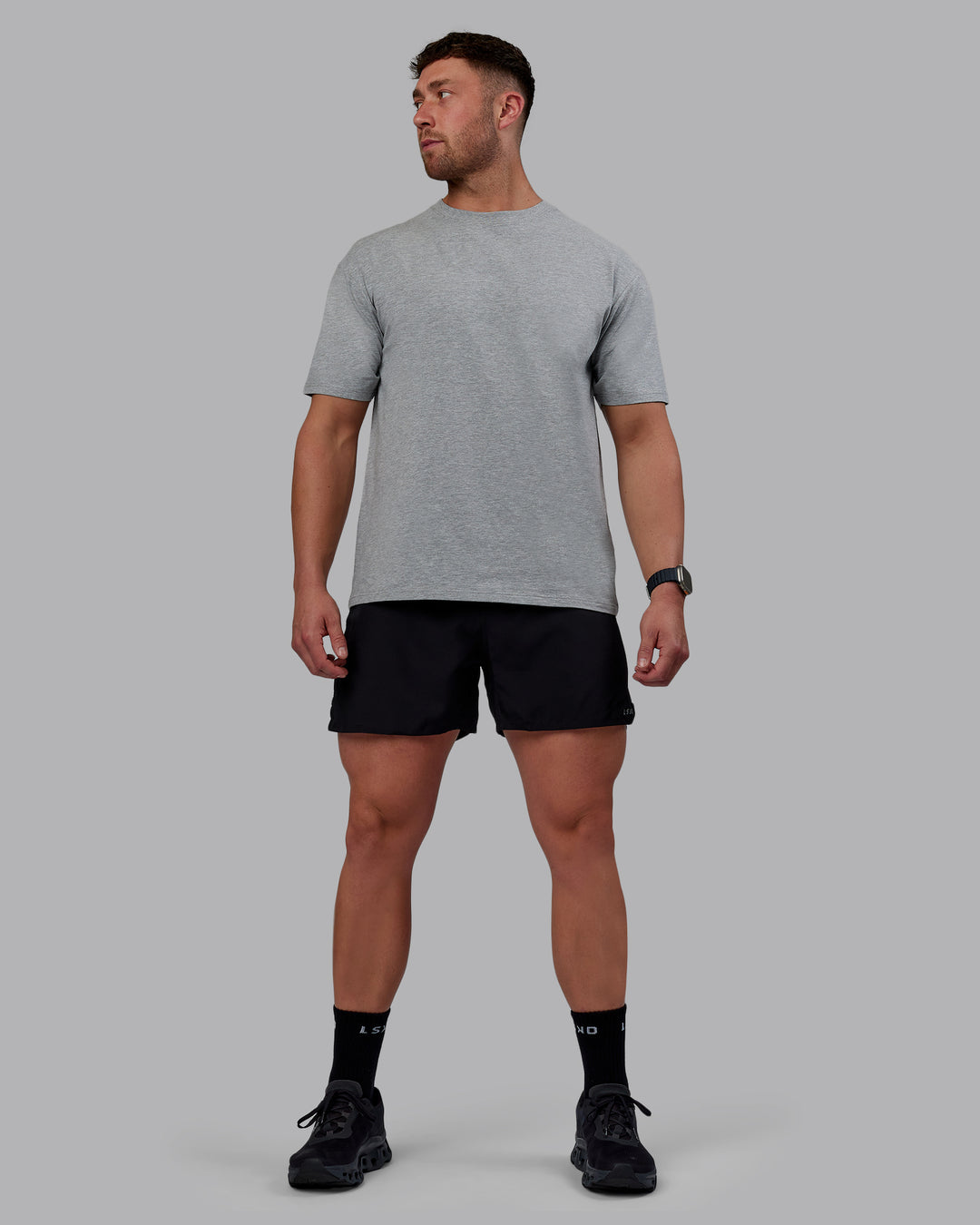 Man wearing Unisex Love The Run FLXCotton Tee Oversize - Light Grey Marl-Black