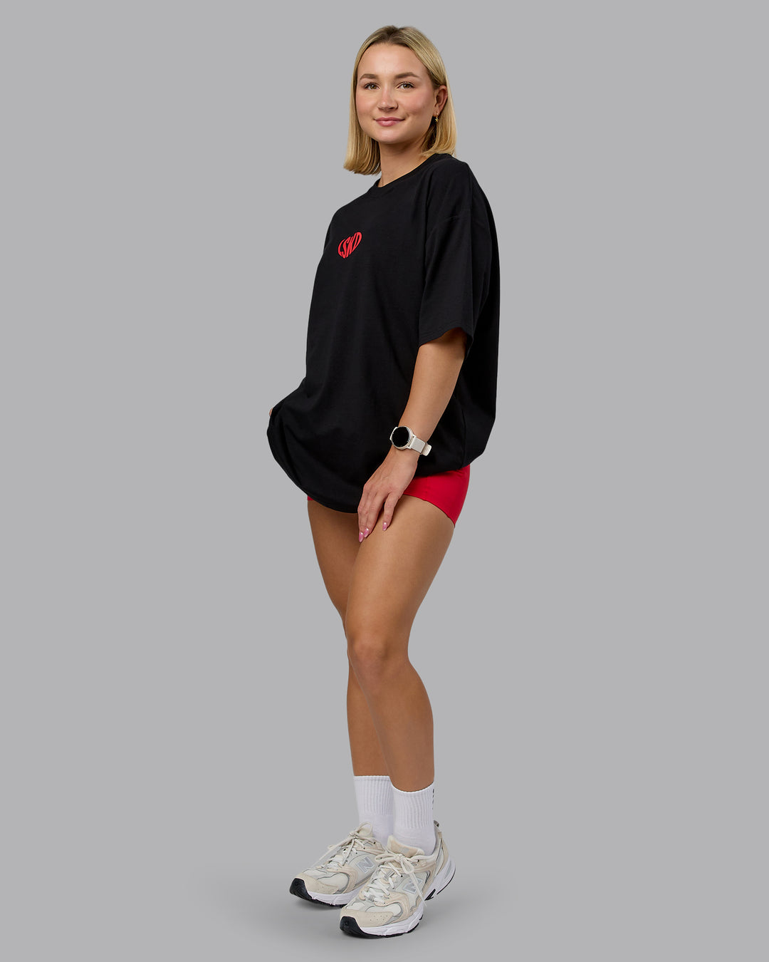 Woman wearing Unisex Love To Train FLXCotton Tee Oversize in Black-Scarlet | Size:L