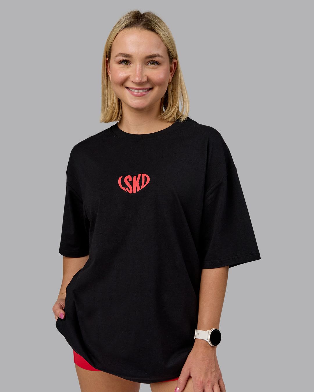 Woman wearing Unisex Love To Train FLXCotton Tee Oversize in Black-Scarlet | Size:L