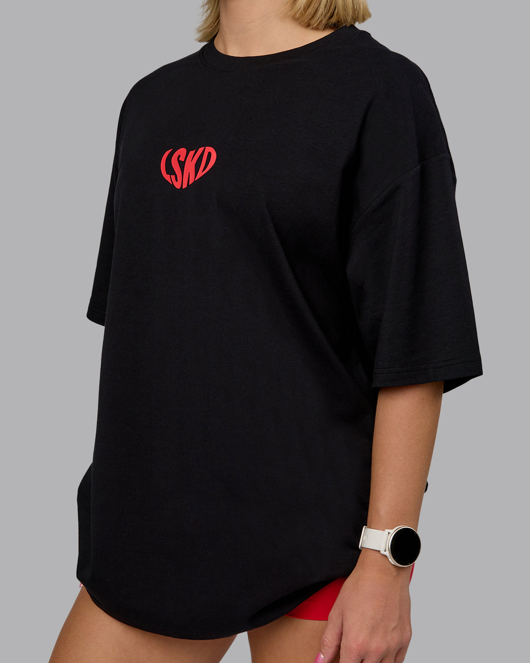 Woman wearing Unisex Love To Train FLXCotton Tee Oversize in Black-Scarlet | Size:L