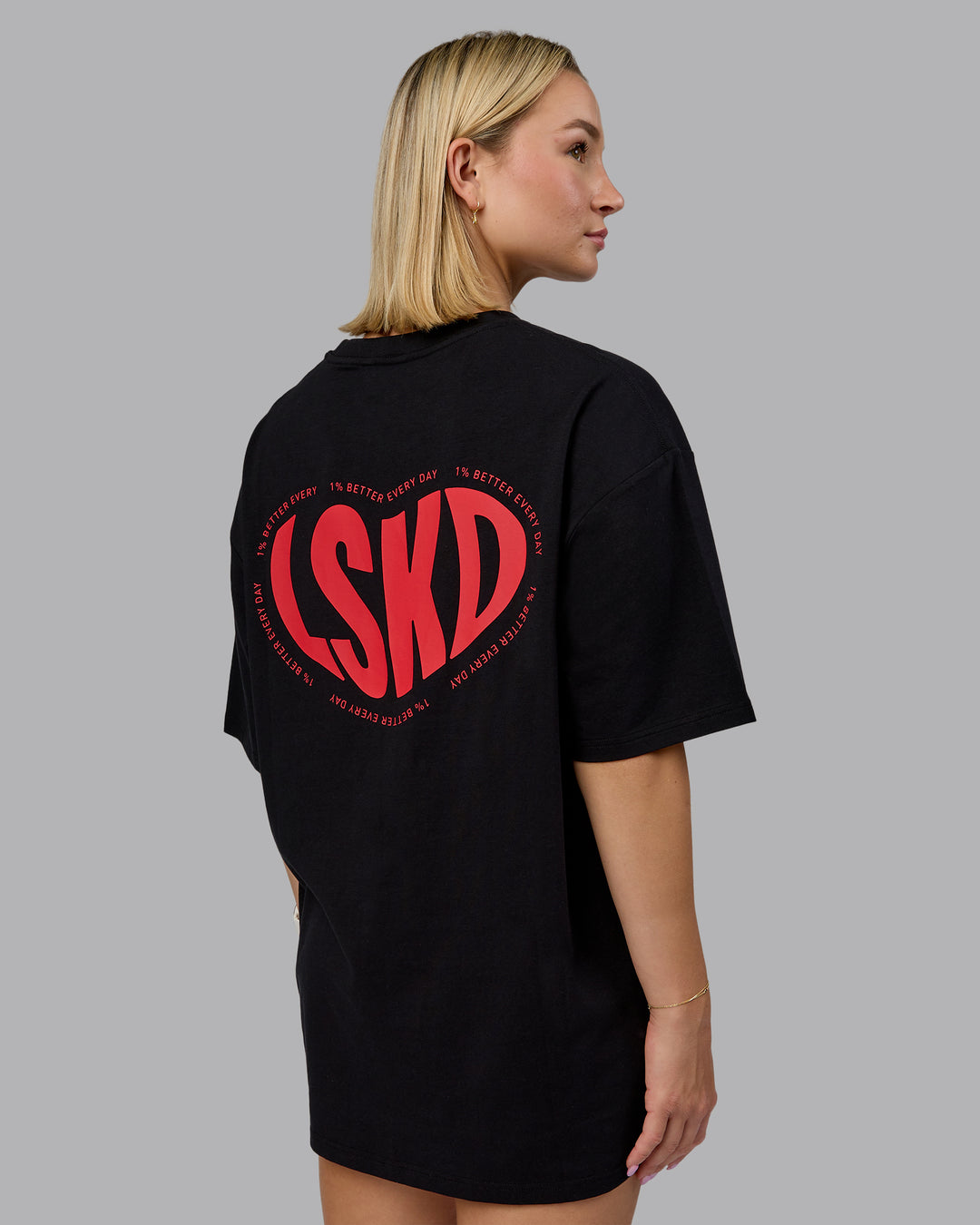 Woman wearing Unisex Love To Train FLXCotton Tee Oversize in Black-Scarlet | Size:L