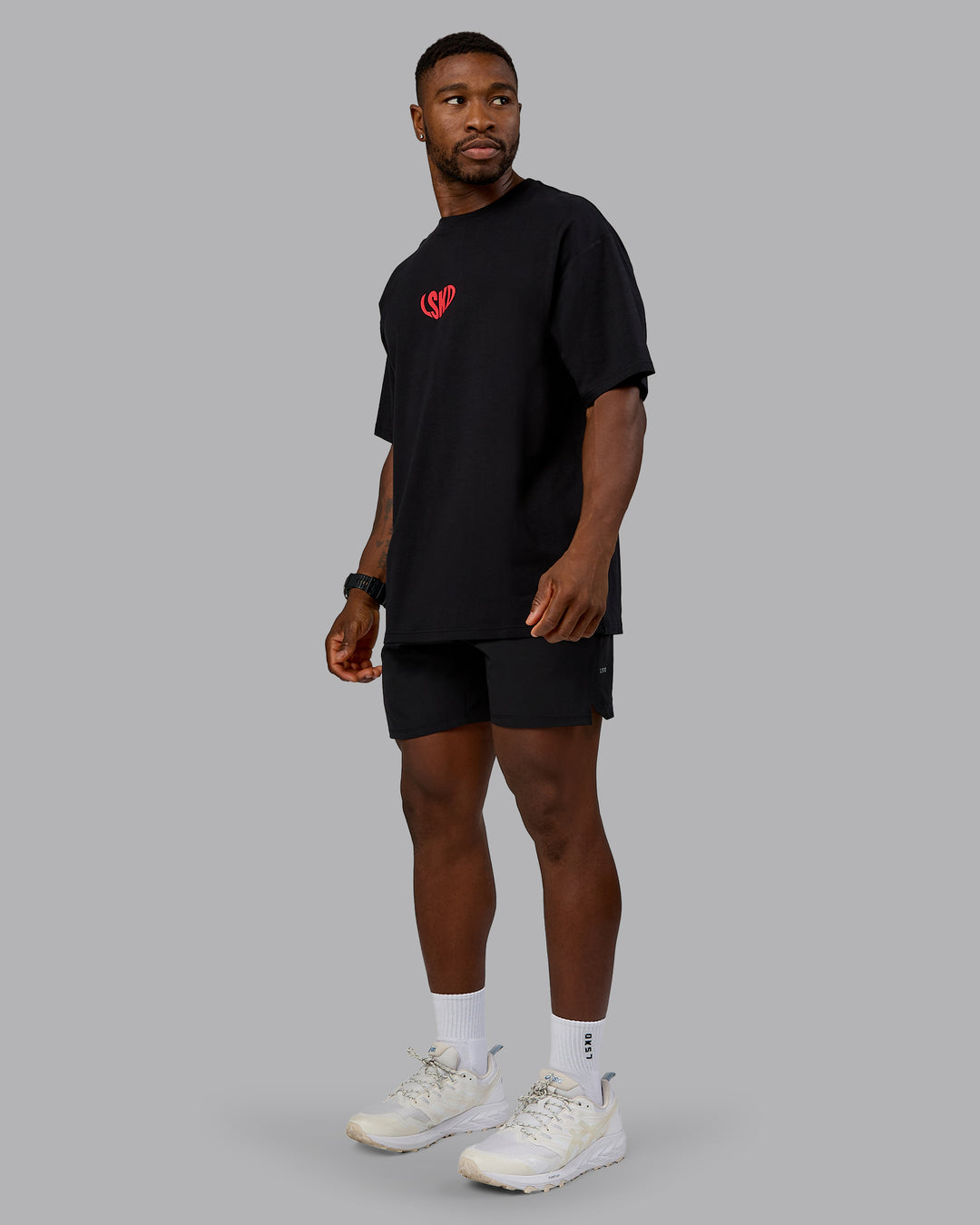 Man wearing Unisex Love To Train FLXCotton Tee Oversize in Black-Scarlet | Size:L