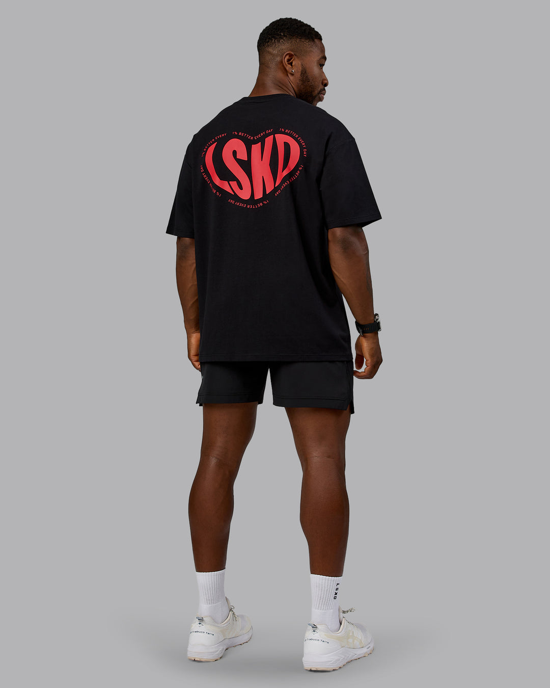 Man wearing Unisex Love To Train FLXCotton Tee Oversize in Black-Scarlet | Size:L