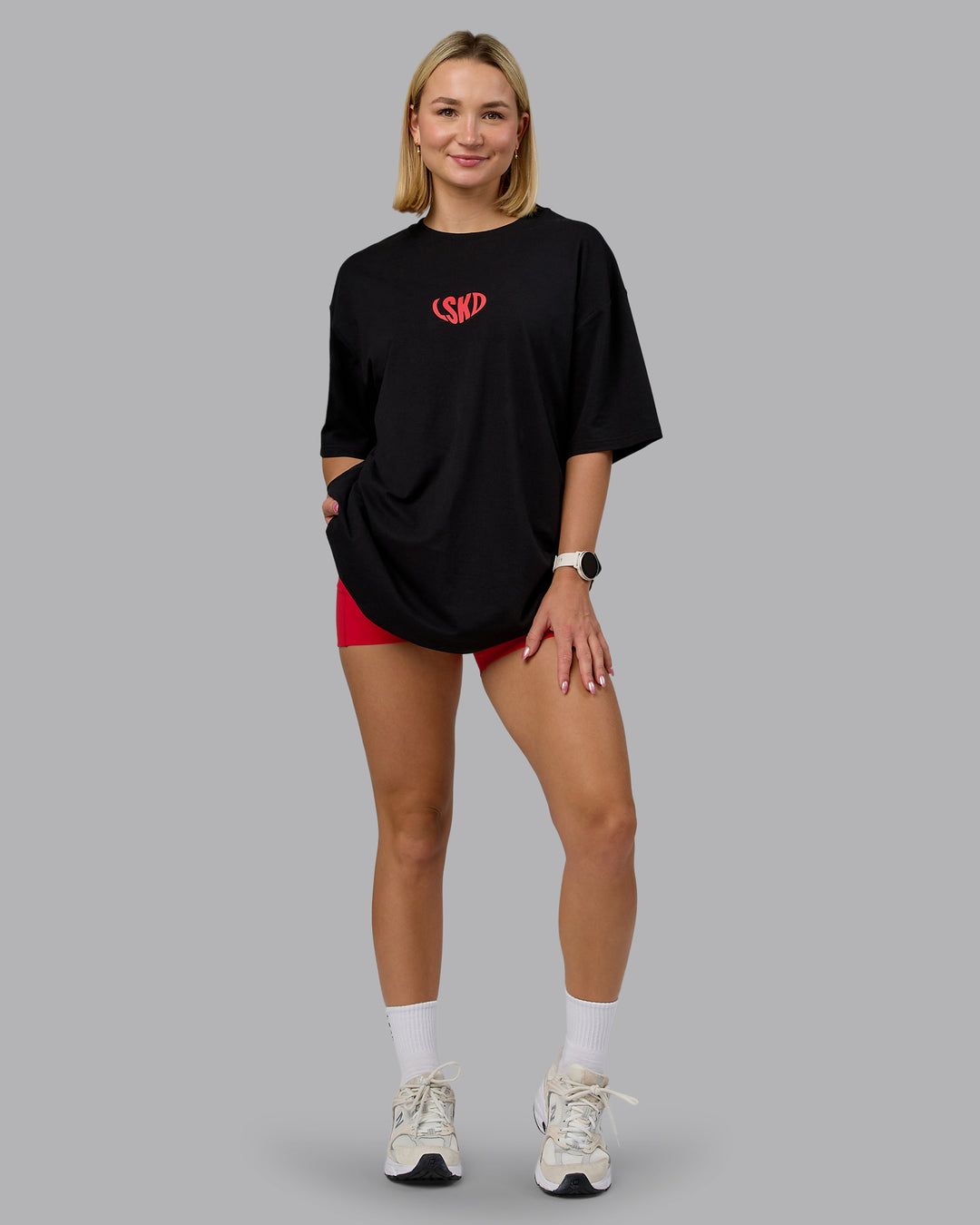 Woman wearing Unisex Love To Train FLXCotton Tee Oversize in Black-Scarlet | Size:L