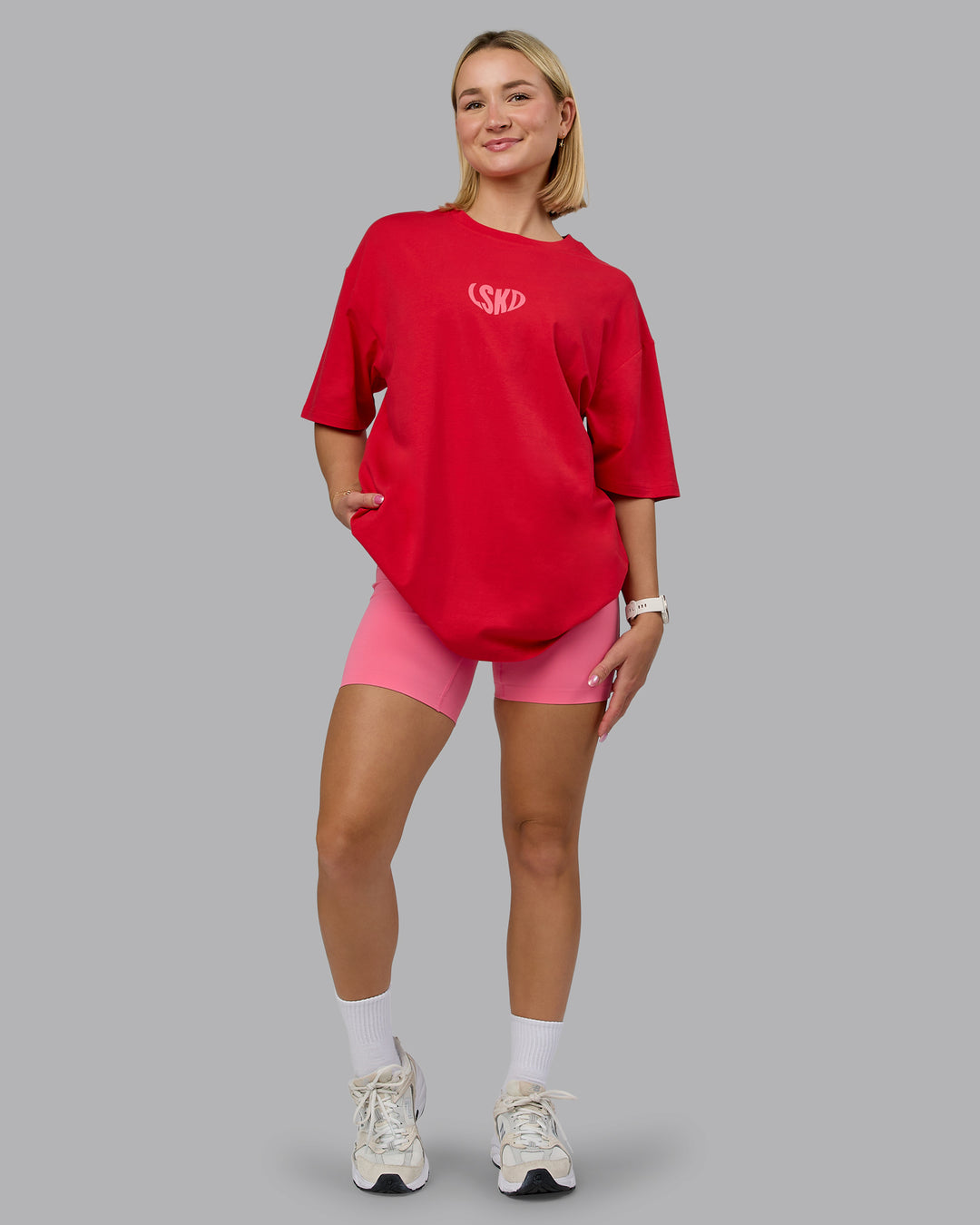 Woman wearing Unisex Love To Train FLXCotton Tee Oversize in Scarlet-Pink Lemonade | Size:L