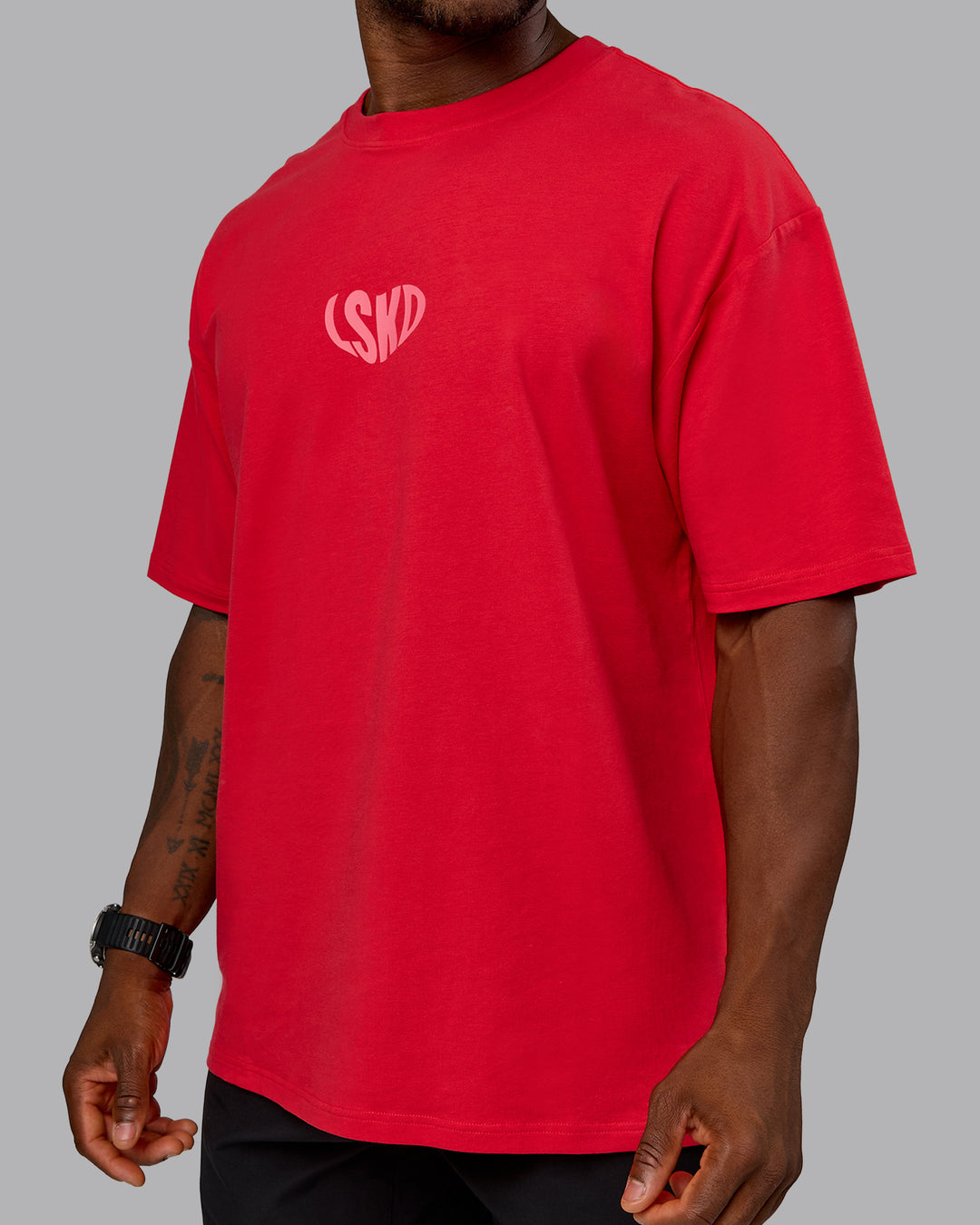 Man wearing Unisex Love To Train FLXCotton Tee Oversize in Scarlet-Pink Lemonade | Size:L