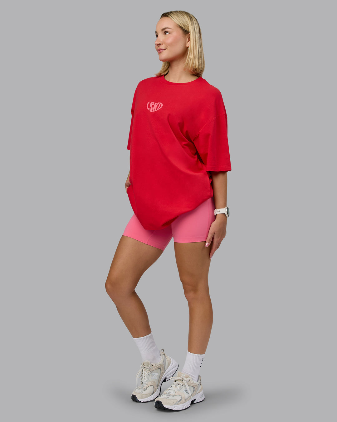 Woman wearing Unisex Love To Train FLXCotton Tee Oversize in Scarlet-Pink Lemonade | Size:L