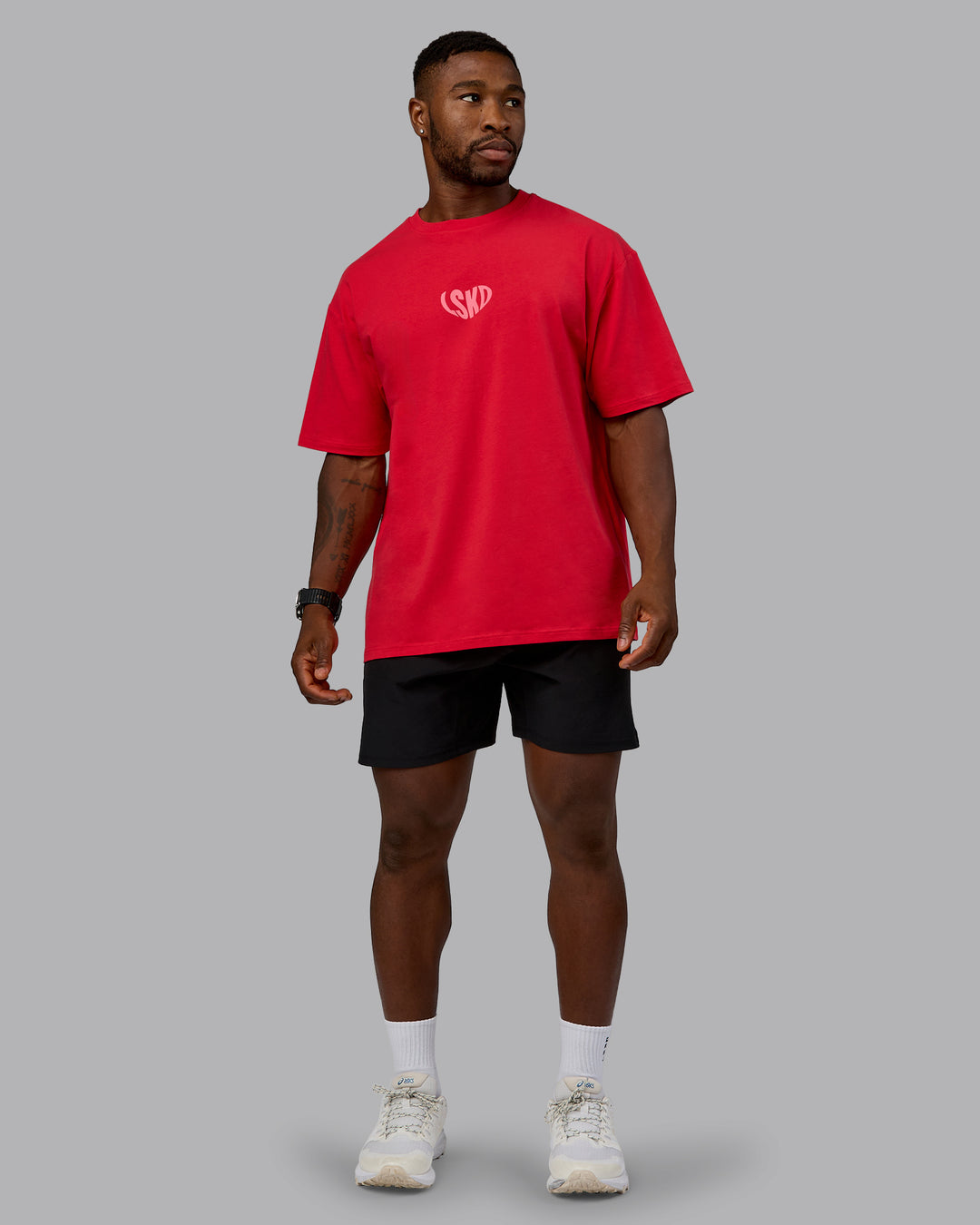 Man wearing Unisex Love To Train FLXCotton Tee Oversize in Scarlet-Pink Lemonade | Size:L