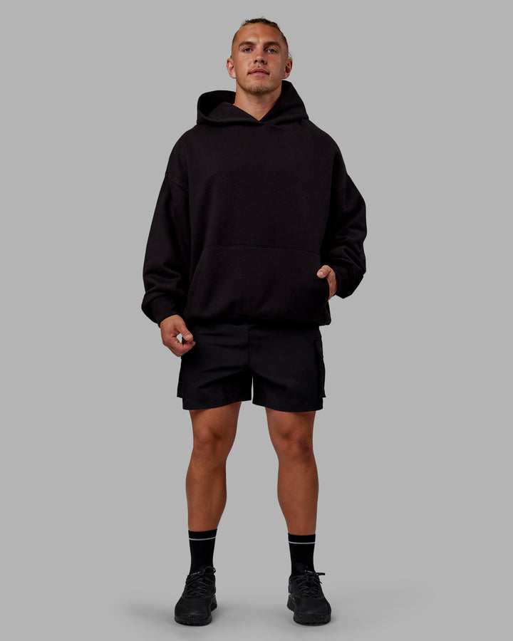 Man wearing Sara Unisex Hoodie Oversize - Black-Black
