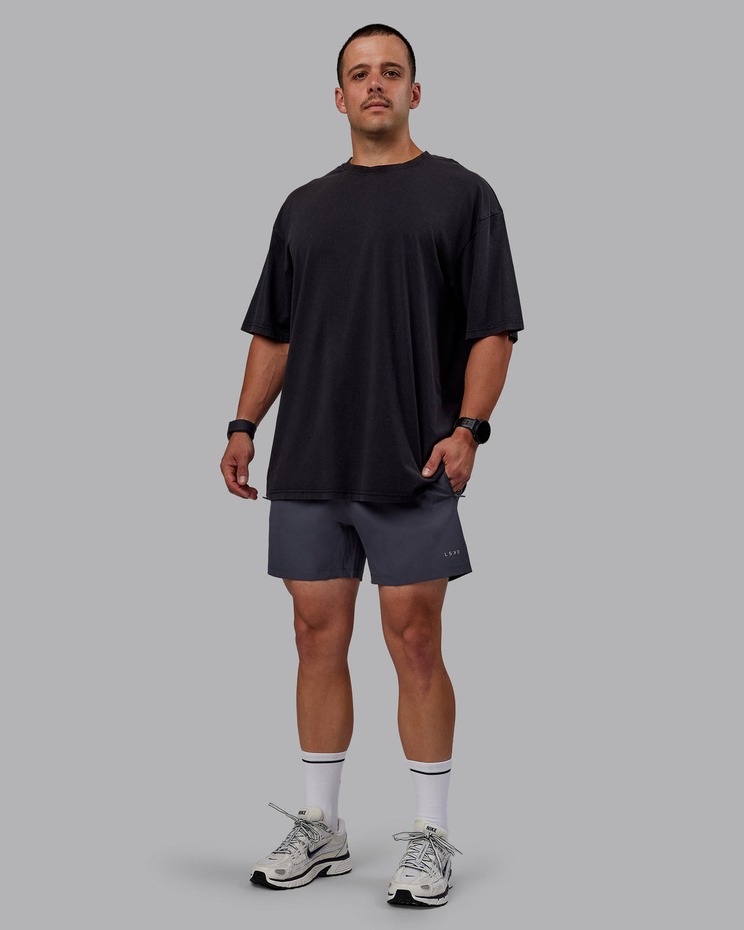 Man wearing Set The Standard Washed FLXCotton Oversized Tee in Black-Black | Size:L