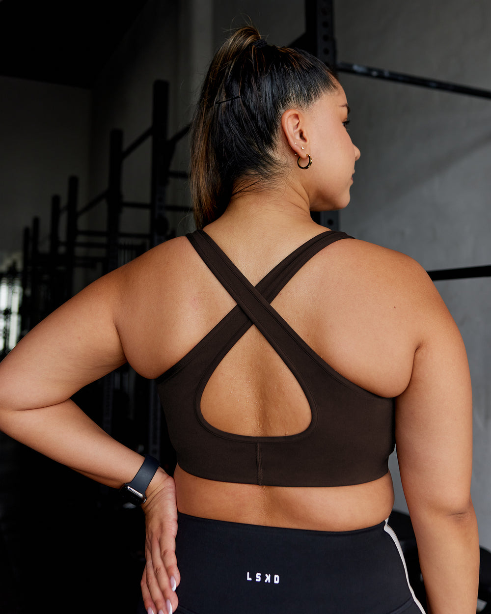 Woman wearing Stamina Sports Bra - Dark Walnut | Model:Gloria | Size:M