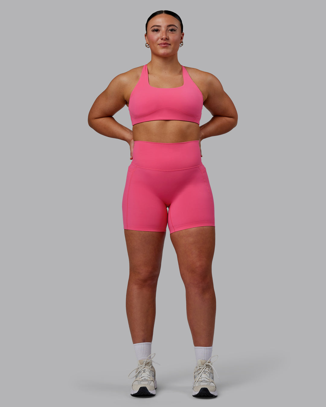 Woman wearing Aspire Sports Bra - Carmine Rose