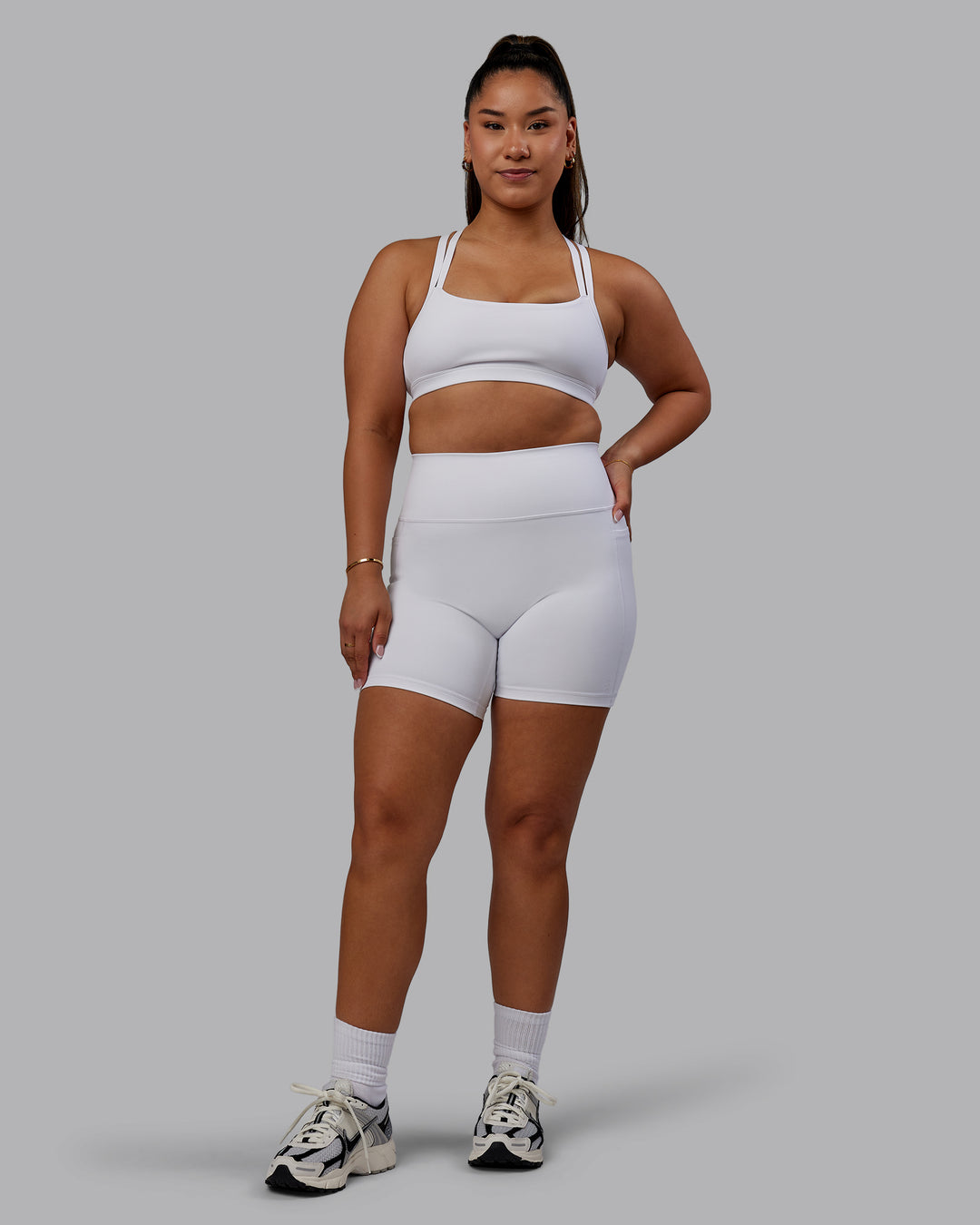 Woman wearing Bree Masters Velocity Sports Bra - White