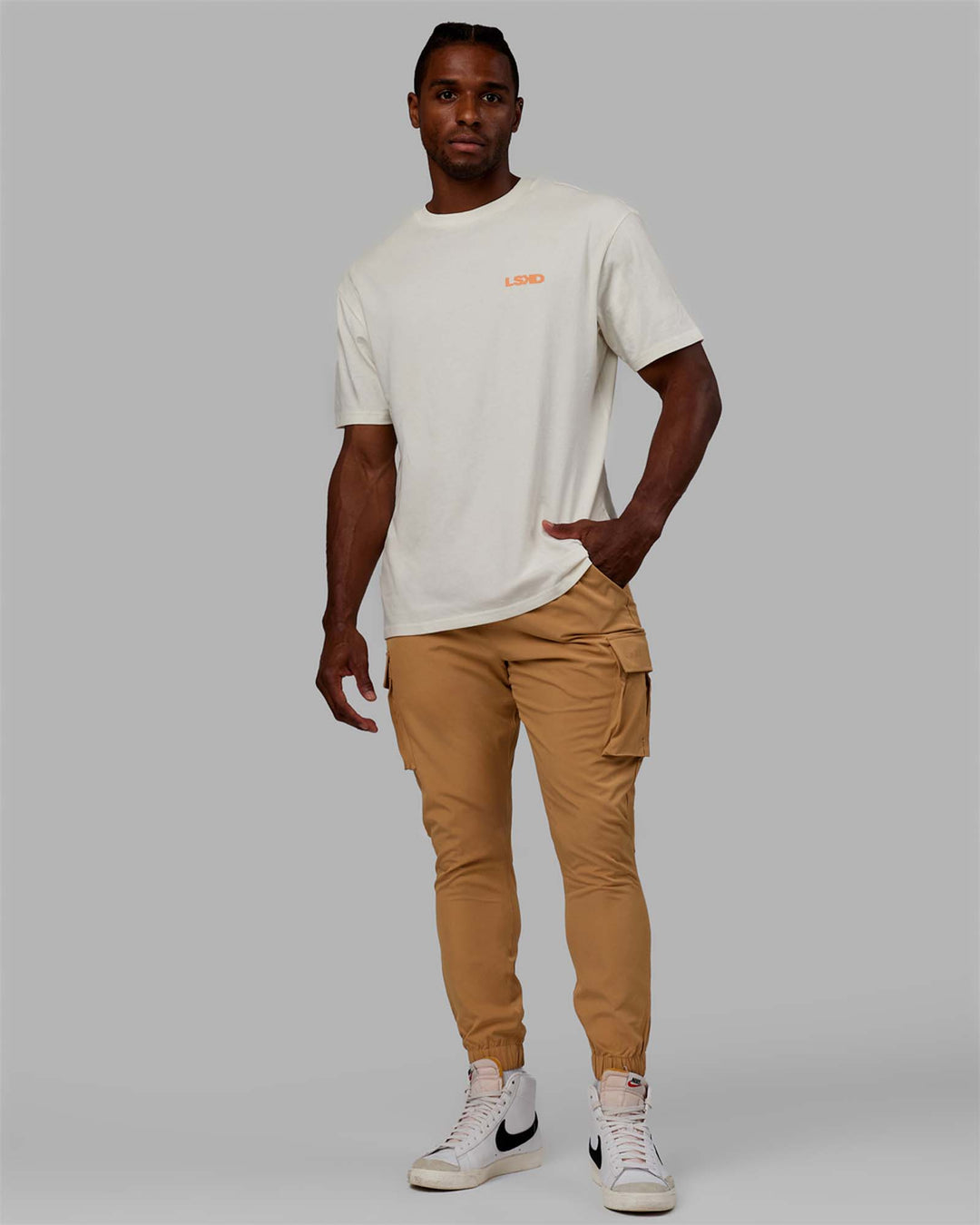 Man wearing Energy Stretch Performance Cargo Joggers - Latte