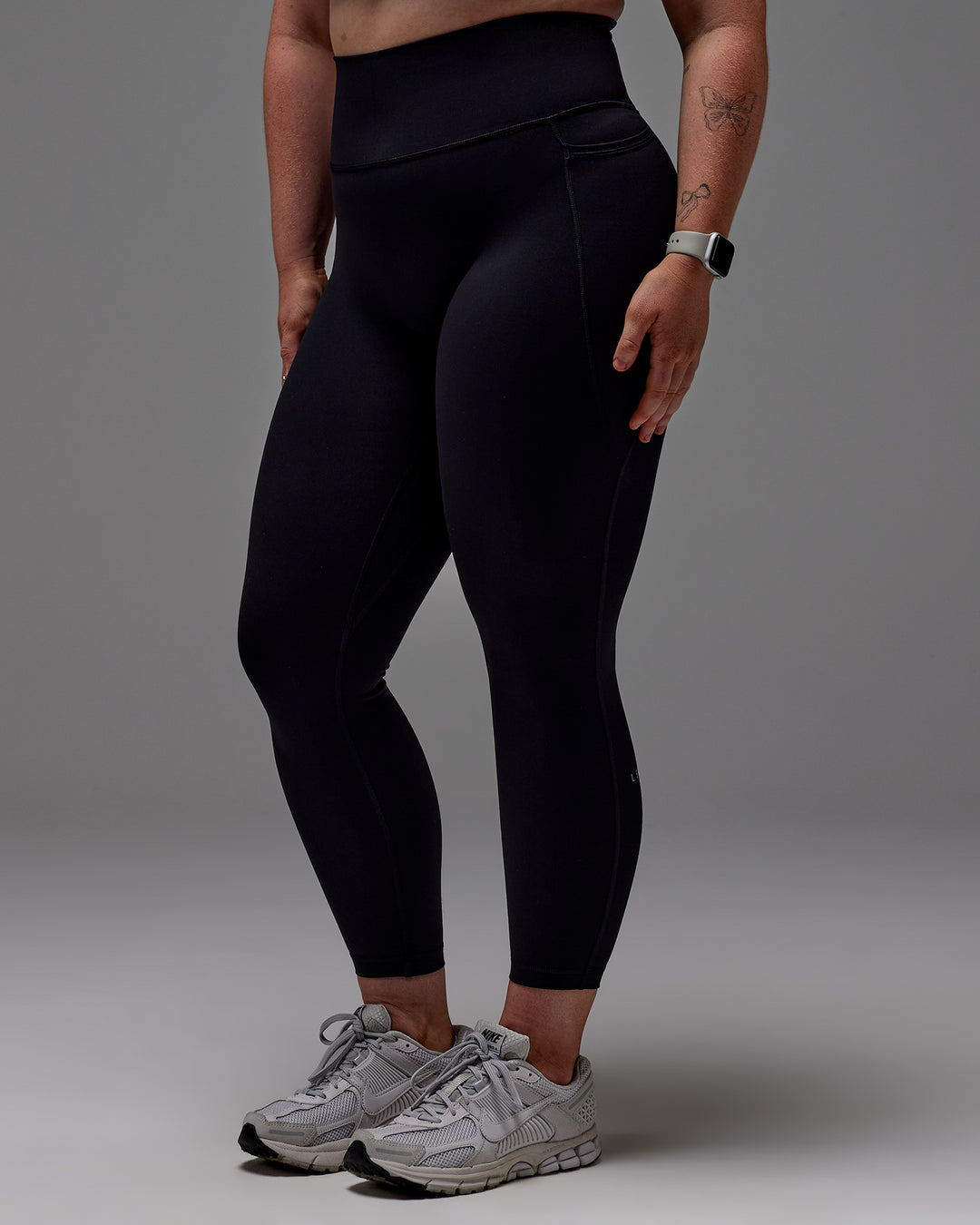 Woman wearing Fusion 7/8 Length Tight With Pockets in Black | Model:Caity | Size:M