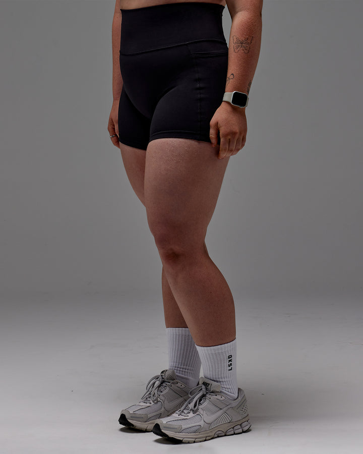 Woman wearing Fusion X-Short Tight With Pockets in Black | Model:Caity | Size:M
