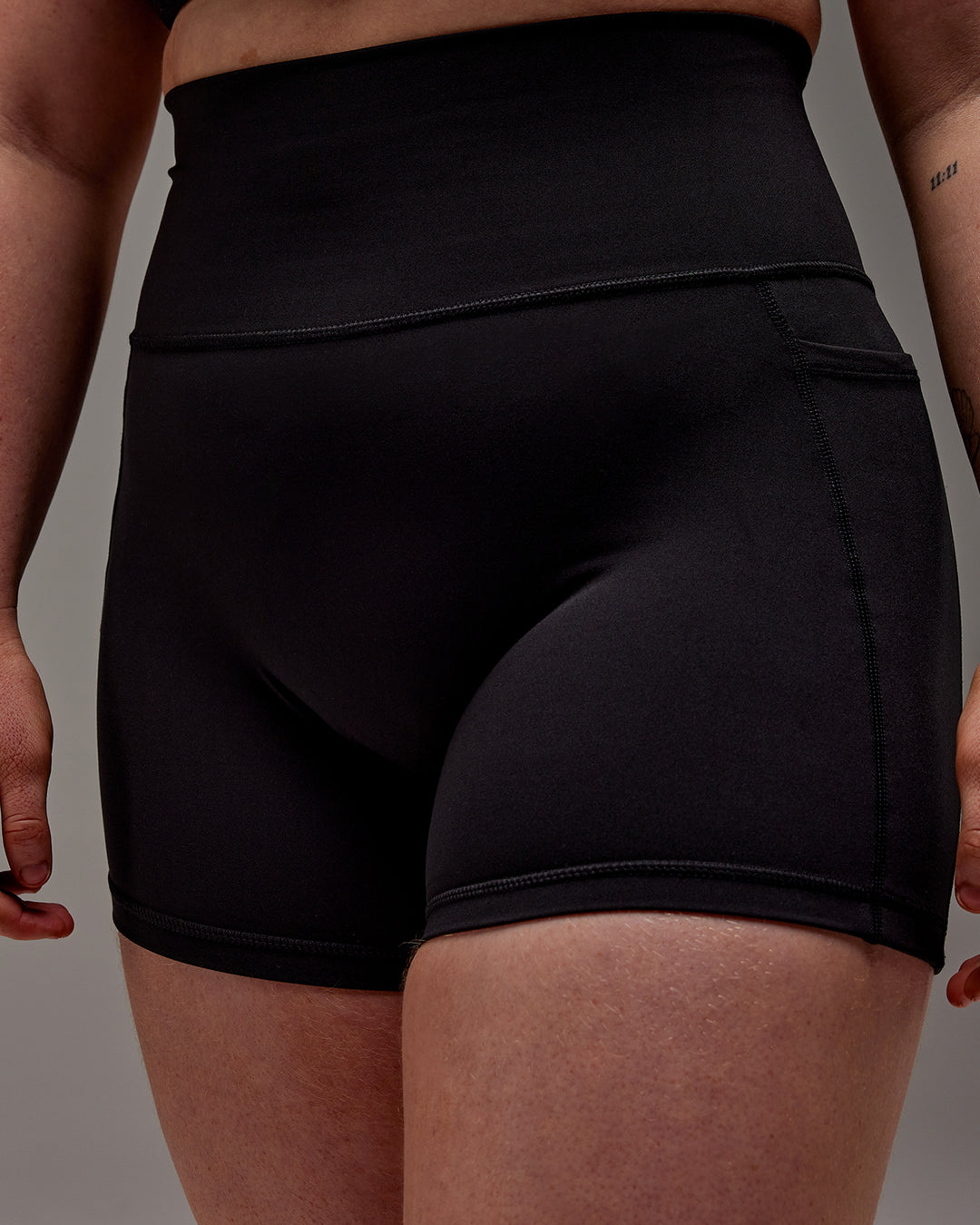 Woman wearing Fusion X-Short Tight With Pockets in Black | Model:Caity | Size:M