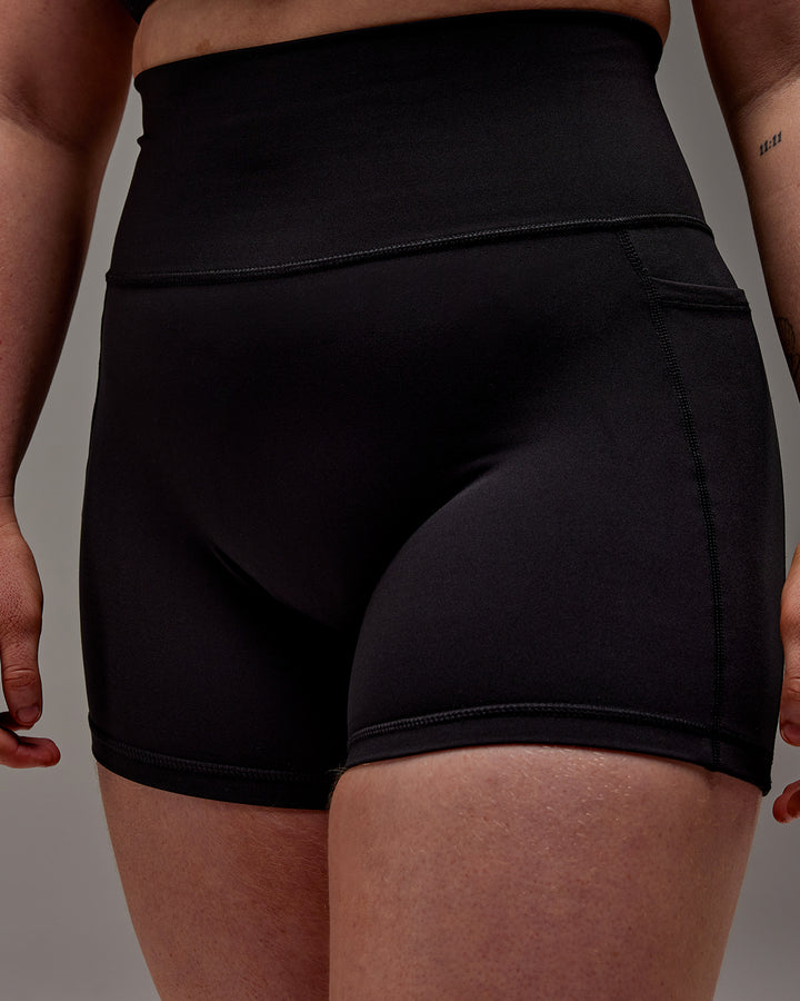 Woman wearing Fusion X-Short Tight With Pockets in Black | Model:Caity | Size:M
