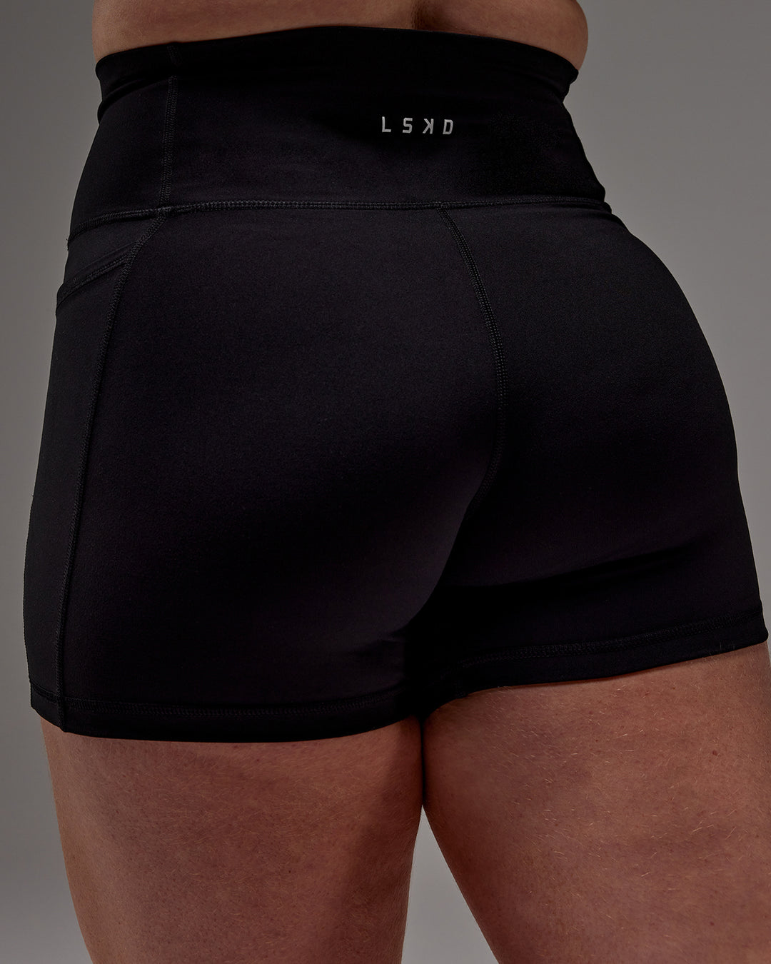 Woman wearing Fusion X-Short Tight With Pockets in Black | Model:Caity | Size:M